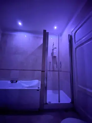 a bathroom with a shower and a tub and a sink at Argilla Apartment in Rome