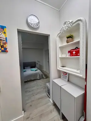 a room with a mirror and a bed at Charme Holidays San Saba in Rome
