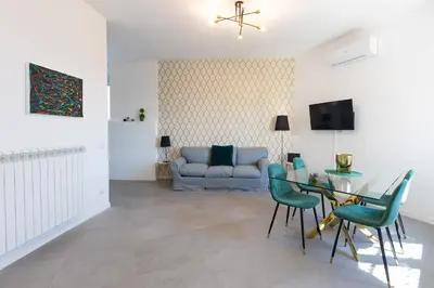 a living room with a table and a couch at Vatican Secret Apartment in Rome