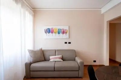 a white cabinet in a room with a window at Modern Apartment near Vatican & Foro Italico - Rome in Rome
