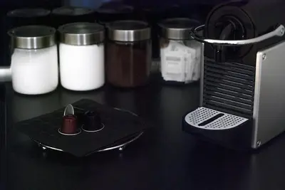 a black counter top with a toaster and some jars at App Leoncino Design Apartment in Rome in Rome