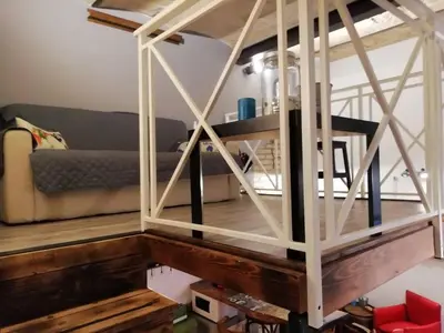 a living room with a wooden table and a couch at FCR Rome Apartments Sweet Nest of Love in Rome