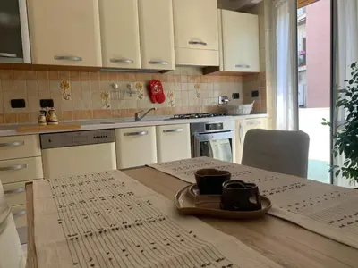 a kitchen with a table with two cups on it at Lilly's Apartment a 5 minuti Metro C in Rome