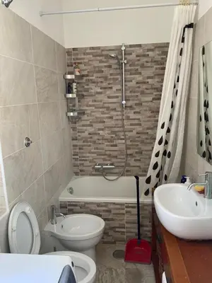 a bathroom with a toilet and a sink and a shower at camera singola al Pigneto in Rome
