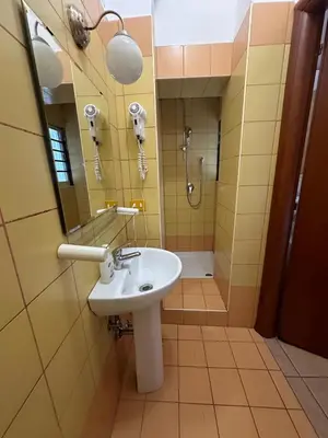 a bathroom with a sink and a shower at Near Termini station in Rome