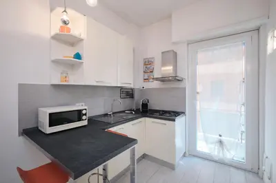 a kitchen with a counter top with a microwave at Apt at Tiburtina Station Free WiFi e Netflix in Rome