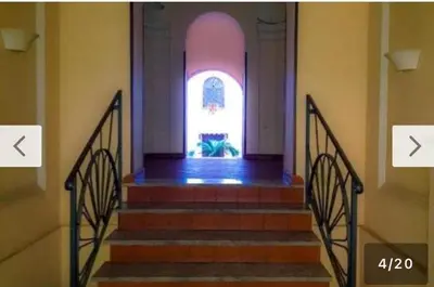 a set of stairs in a building with an open door at Loft Flower Colosseum in Rome