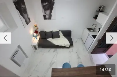 a living room with a couch and a table at Loft Flower Colosseum in Rome