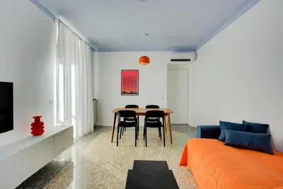 a living room with a table and chairs and a couch at Casa Chiro 79 in Rome