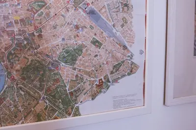 a map of a city hanging on a wall at Charming 3-Guest Apt in San Giovanni Landmark in Rome