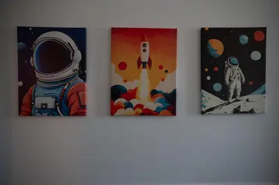 three pieces of art hanging on a wall at Casa Mercanti in Rome
