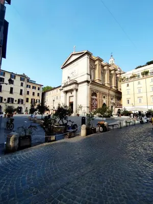 a building on a cobblestone street in a city at Residenza Coronari in Rome