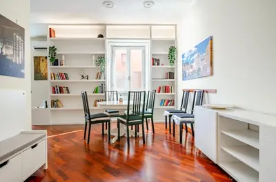 a living room with a couch and a tv at Hot Tub - Private Parking - park in Rome