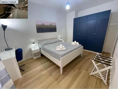 a bedroom with a bed and a chair in it at House - Via Madonna del Riposo - Too in Rome