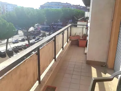 a balcony of a building with a view of a street at Dolce Roma House - Parco Appia Antica , Netflix, Prime e Metro sotto casa in Rome