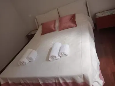 a white bed with towels and pillows on it at Rome full apt 4 people close to Colosseum Mao house in Rome
