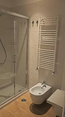 a bathroom with a shower and a toilet and a sink at La Belle Étoile in Rome
