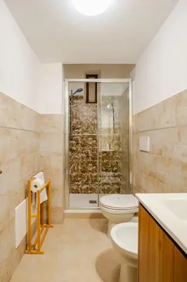 a bathroom with a toilet and a shower at Colosseo Comfort e Stile in centro a Roma in Rome