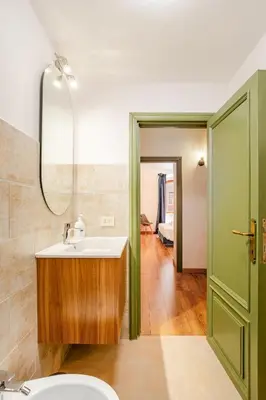 a bathroom with a sink and a mirror at Colosseo Comfort e Stile in centro a Roma in Rome
