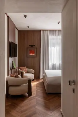 a living room with a bed and a couch at NAMAN HOTELLERIE - Roma in Rome
