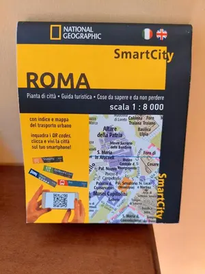 a box with a remote control and a map at Accommodation in Rome near Termini Loft San Lorenzo in Rome