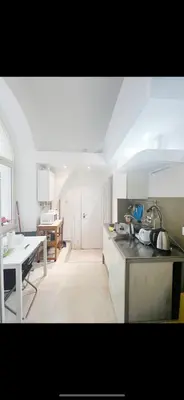 a kitchen with a table and a counter top at Miniapartment in the center of Rome in Rome