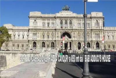 a large building with a sign in front of it at Bed and Breakfast Adduci's House in Rome