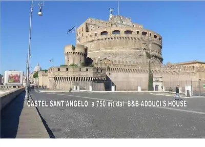 a large building with a sign in front of it at Bed and Breakfast Adduci's House in Rome