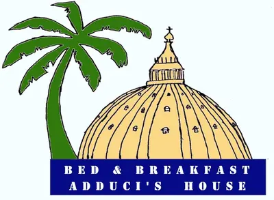 a palm tree and the red and breakfast adirondack auditions house logo at Bed and Breakfast Adduci's House in Rome