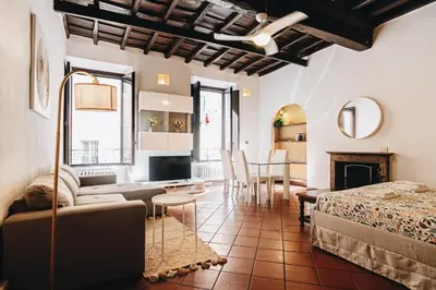 a living room with a couch and a table at Persia Collection Ripetta in Rome