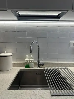 a kitchen sink with a faucet in a kitchen at Rhome Holiday Home Casal Bertone in Rome