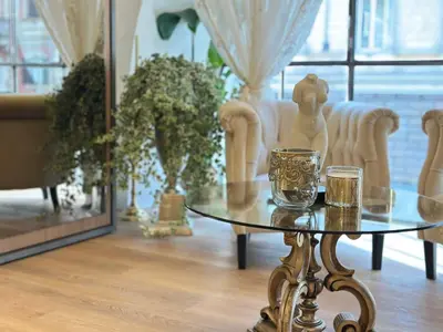 a table with two glasses on it in a living room at Trevi Fountain Elegant Suites by Marianna in Rome