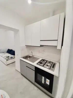 an open door to a room with a wooden door at Rome Central Colosseum Flat in Rome