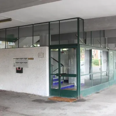 a building with a green door on the side of it at Apartment SIX Rome Flaminio - Villaggio Olimpico in Rome