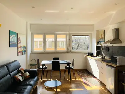 a living room with a couch and a table at Apartment SIX Rome Flaminio - Villaggio Olimpico in Rome