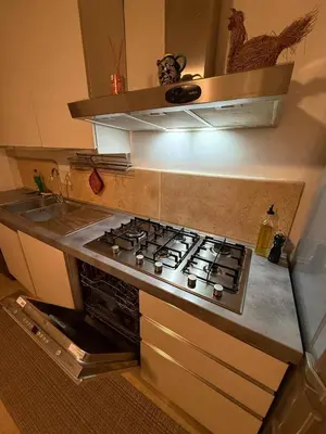 a kitchen with a stove top oven in a kitchen at Family Entire House in Rome