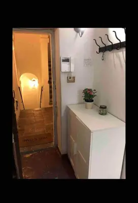a room with a white counter and a hallway at Nice apartment in the historic center in Rome