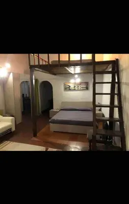 a bedroom with a bunk bed and a ladder at Nice apartment in the historic center in Rome