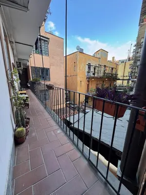 a balcony with a fence and potted plants at Garibaldi Studio Apt in Rome