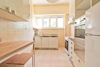 a kitchen with a sink and a stove top oven at White Boutique Apartment in Rome