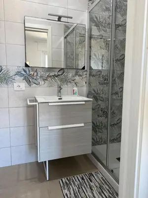 a bathroom with a sink and a shower at Home in Roma in Rome