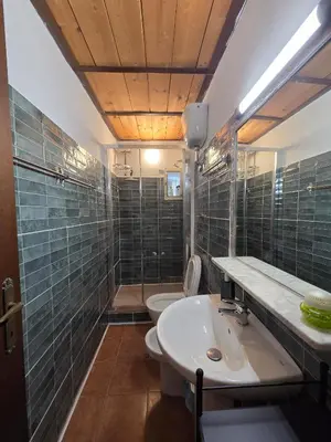 a bathroom with a sink and a toilet and a shower at Casa Guardini in Rome in Rome