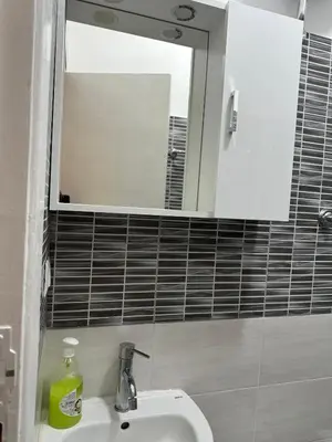 a bathroom with a sink and a mirror at Roma Guest house Aversa 55 in Rome