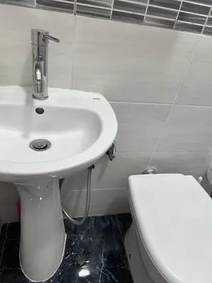 a bathroom with a white sink and a toilet at Roma Guest house Aversa 55 in Rome
