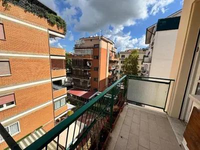 an apartment balcony with a view of buildings at Banksy Urban Suite in Rome