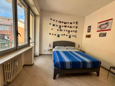 a bedroom with a bed and a large window at Banksy Urban Suite in Rome