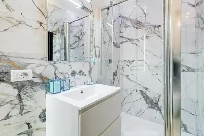 a bathroom with a white sink and a shower at Vatican Scipioni Charming Studio relaxing and patio in Rome