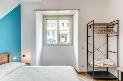 a bedroom with a bed and a window at Albadoro Apartment in Rome