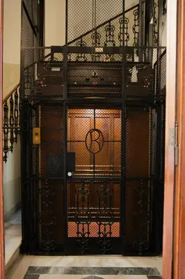 an open door with a gate in a room at Caesarina Roma, Luxury apartment in Rome