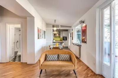 a living room with a couch and a table at Porta maggiore 2 bedroom with terrace in Rome